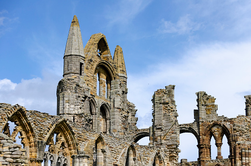 An image of Whitby Abbey, England, capturing the essence of this picturesque seaside town with its historic charm and maritime heritage. Known for its dramatic cliffs, the ruins of Whitby Abbey, and the quaint harbour, Whitby epitomises the beauty and character of the Yorkshire coast.
