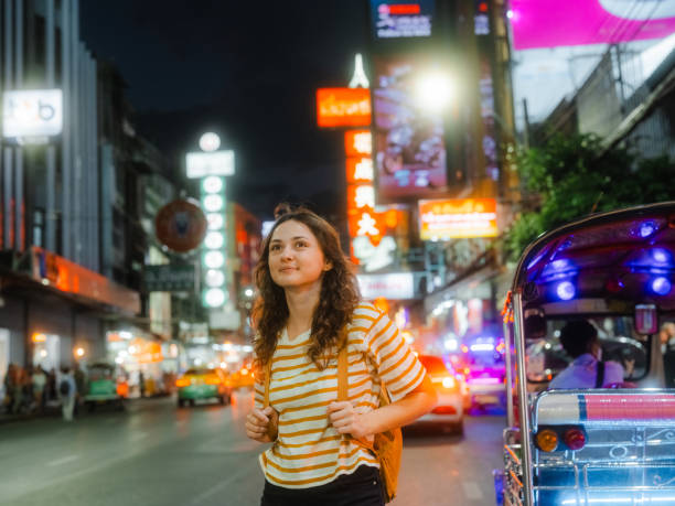 istock Woman exploring Chinatown in Bangkok at night 1932761817