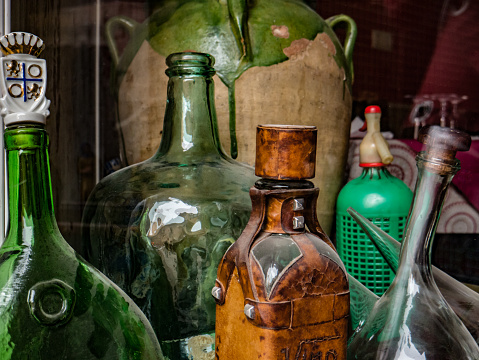 Photo of still life with old glass bottles and siphon