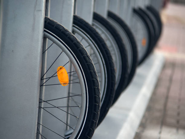 Bicycle wheels with orange reflectors in the parking lot