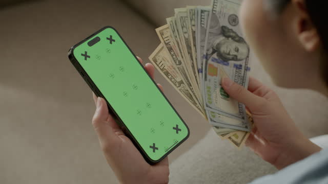 Green screen smart phone with Dollar cash