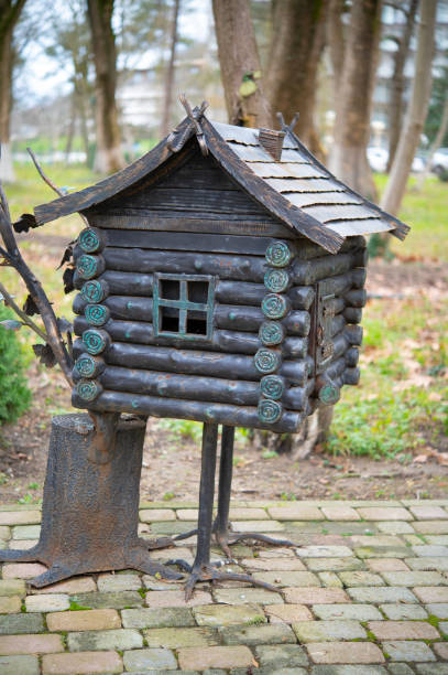 A small decorative hut on chicken legs for decorating gardens and parks.