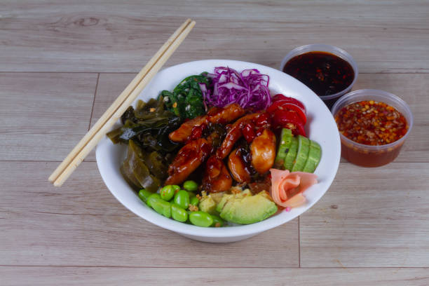 istock Teriyaki chicken on plate over black stone background. with chopsticks. 1932838353