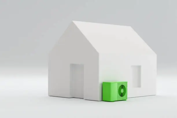 Model home with a green heatpump. Concept for sustainable heating with electric heatpumps.