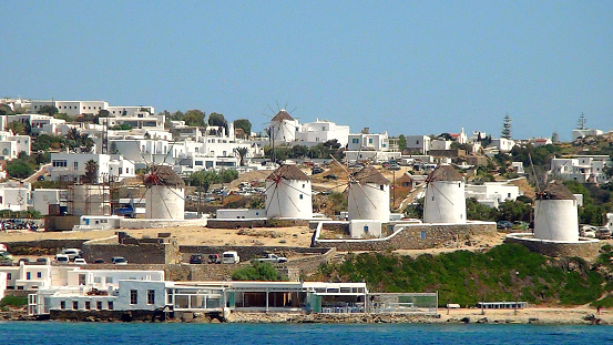 view of the five famous white windmills of Mykonos (Greece), a famous island in the Cyclades archipelago in the heart of the Aegean Sea.