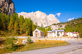 Scenic buildings along a mountain road in the Dolomites