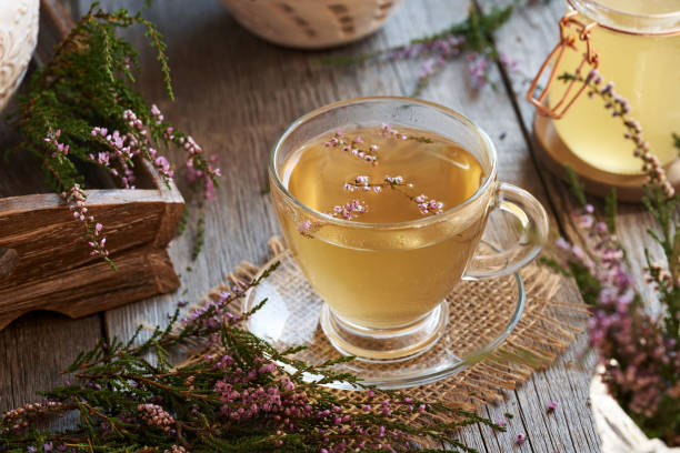 istock Herbal tea with fresh blooming heather plant 1932905132