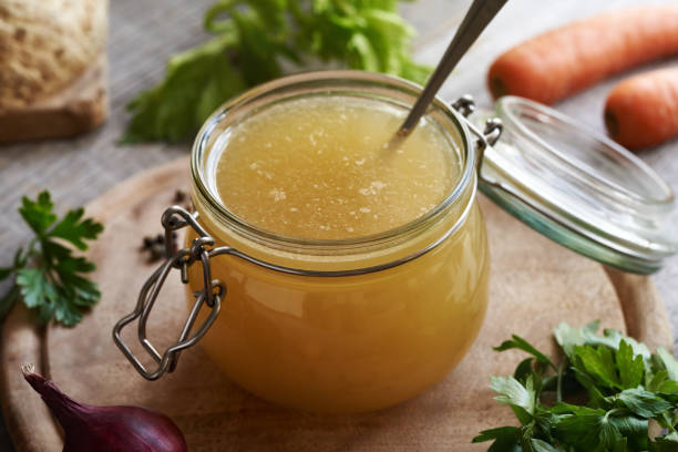 istock Chicken soup or bone broth in a glass jar 1932906720