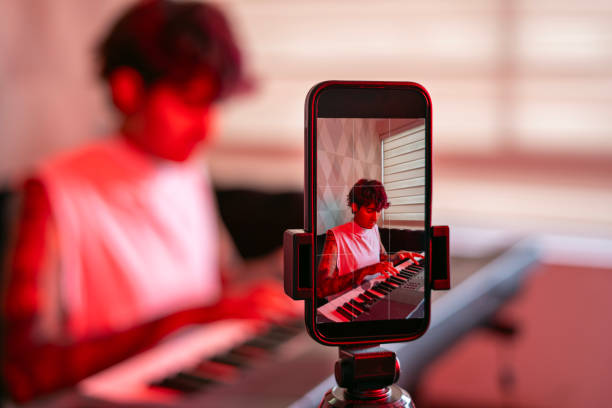 istock Young youtuber creating video content for his social networks. 1932915029
