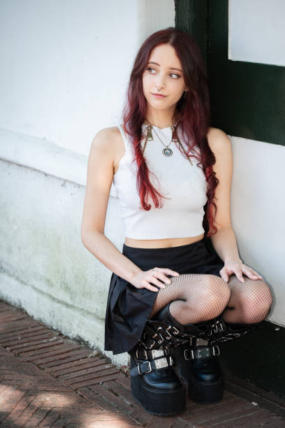 An attractive Alternative female model in an urban setting