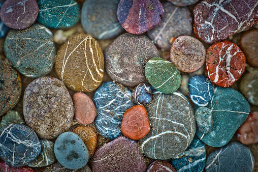 wet multicolored stones on the beach