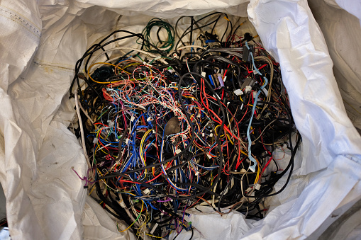 abandoned electrical wires in a recyclable material to landfill
