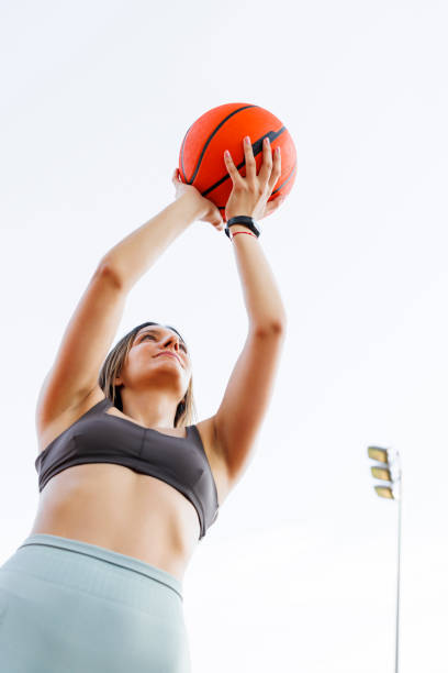 istock Woman playing basketball 1932956204