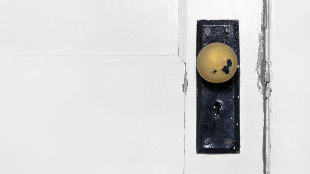 istock Old damaged door knob 1932981711