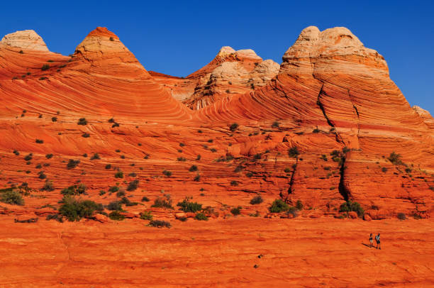 istock Hikers in the sandstone wonderland around The Wave 1932987540
