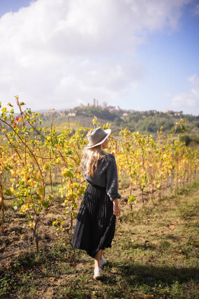 istock Young woman explores vineyard 1933005824