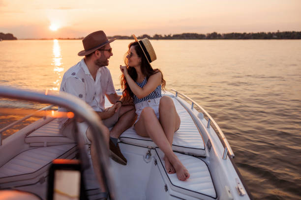 istock Couple sailing to the sunset on a boat while on summer vacation 1933011518