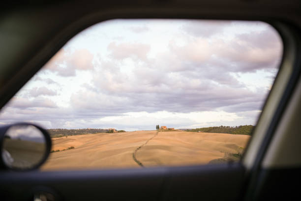 View through vehicle window to countryside in late summer, early autumn