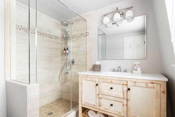 istock A bathroom with a wood cabinet and tiled walk-in shower. 1933074861