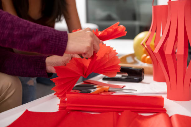 Mother and daughter build  lanterns together