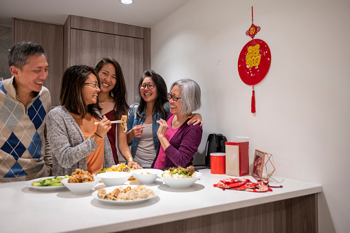 Family shares meal together for Chinese New Year
