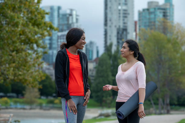 istock Young women walk home from yoga class together 1933107271