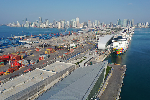 Miami, Florida - April 18, 2020 - Aerial view of cruise ships at Port Miami cruise terminal on sunny cloudless April morning.