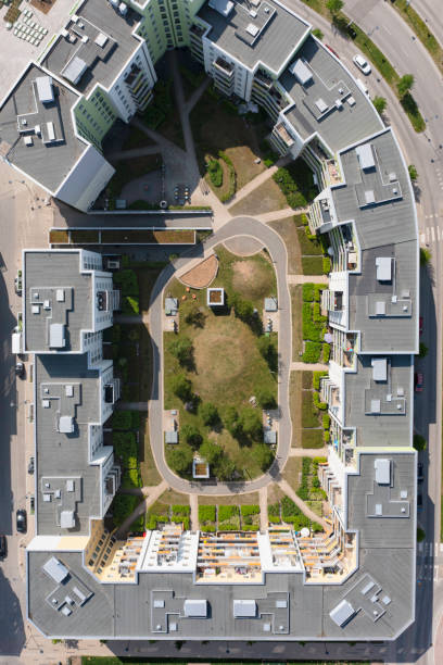 istock Top down view of an apartment building complex with an inner courtyard in summer 1933129964