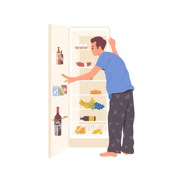 Young man cartoon character in pajamas searching for night snack looking at opened refrigerator Young man cartoon character wearing pajamas searching for night snack looking at opened refrigerator isolated on white background. Male hanger seeking food before bedtime vector illustration clothes hanger storage stock illustrations