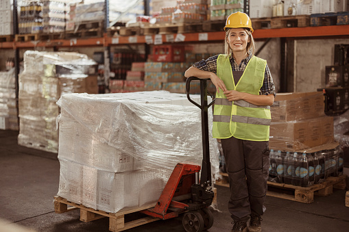 Portrait of female manual worker working in warehouse