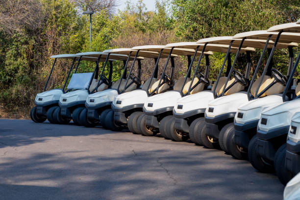 parking supermarket, golf cart security parked and waiting between the cars, modern african mall development