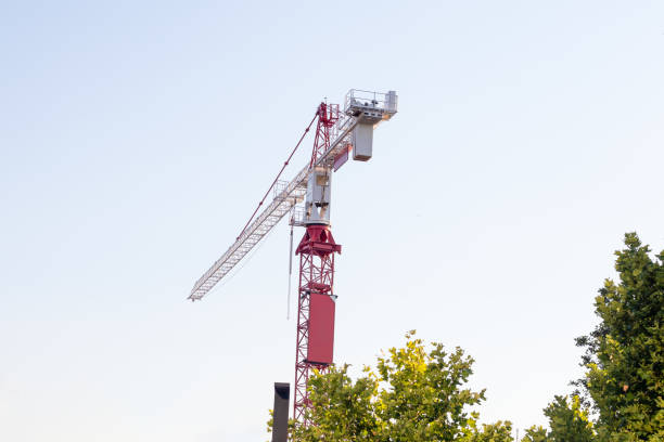 istock Building crane on the construction site with a clear sky 1933210748