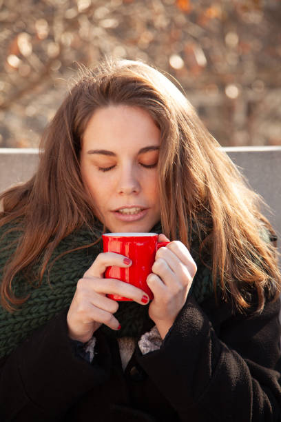 istock Young woman drinking coffee 1933235350