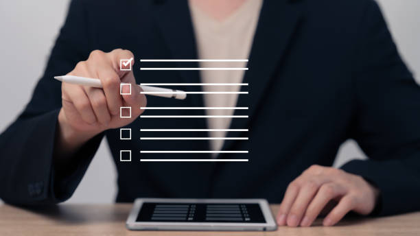 istock Accountants put checkmarks in documents on the topics they have already checked ,Managers assess the quality of each topic ,Market data report analysis ,Checklist with checkmarks and checkboxes. 1933243799