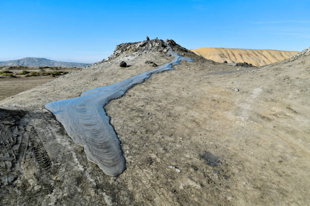 Gobustan, Azerbaijan: mud spewing out from the earth due to compactional stress, Azerbaijan has the most mud volcanoes in the world, with around 300 of them, around a third of all mud volcanoes in the world, some thought to have medicinal qualities. Their occurrence in the area around Qobustan is closely linked to the oil and gas deposits there.