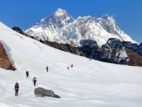 Montage of mount Everest and glacier with hikers, Nepal Himalayas mountains
