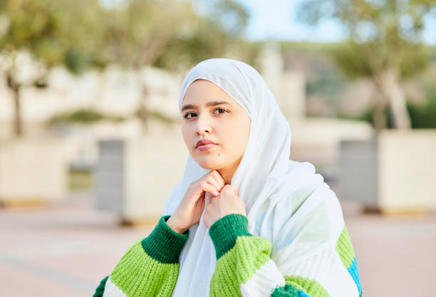 istock Young muslim woman getting on hijab 1933351523