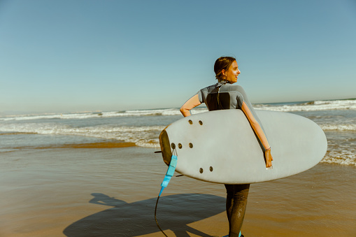 TORQUAY, AUSTRALIA - MAY 28 2023: Surfers go out to tackle huge swell at Bells Beach near Torquay, Victoria, Australia