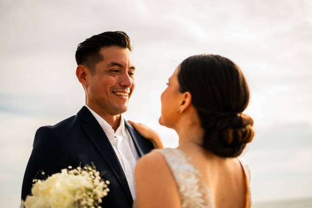 istock Groom and bride talking outdoors 1933360529
