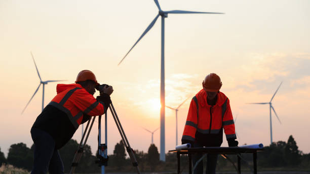 istock Silhouette engineer working at the windmill field. windmills are ecology energy renewable  alternative green power environment factory 1933360535