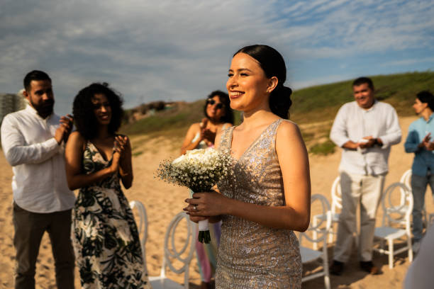 istock Bride entering wedding on the beach 1933361060