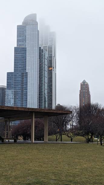 istock Skyscrapers disappearing into fog and clouds 1933361075