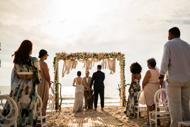 istock Bride and groom in wedding ceremony on the beach 1933362142