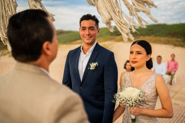 istock Groom and bride in wedding ceremony on the beach 1933362681
