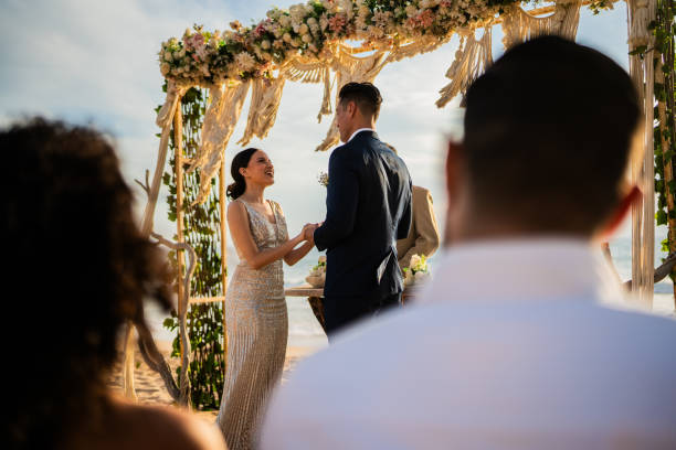 istock Groom and bride in wedding ceremony on the beach 1933364793