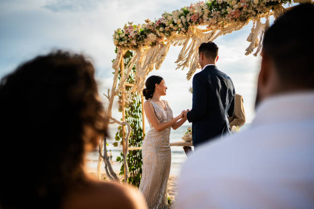 istock Groom and bride in wedding ceremony on the beach 1933364806