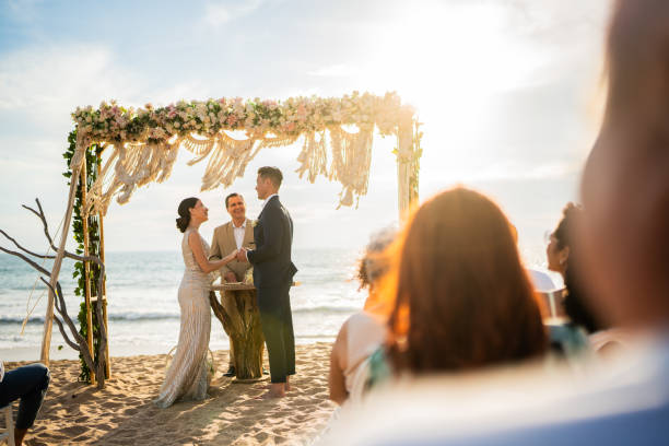 istock Groom and bride in wedding ceremony on the beach 1933364807