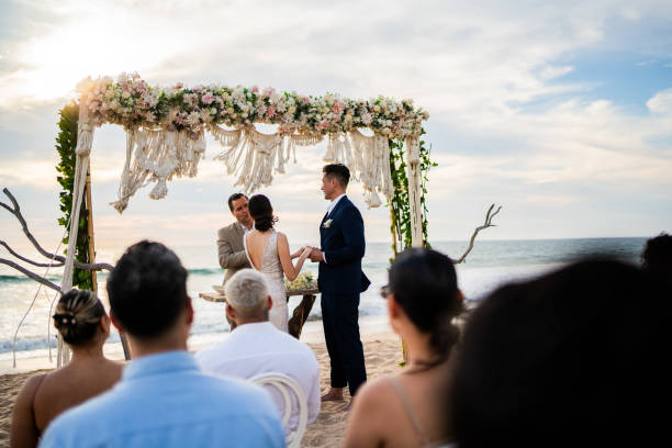 istock Groom and bride in wedding ceremony on the beach 1933364810