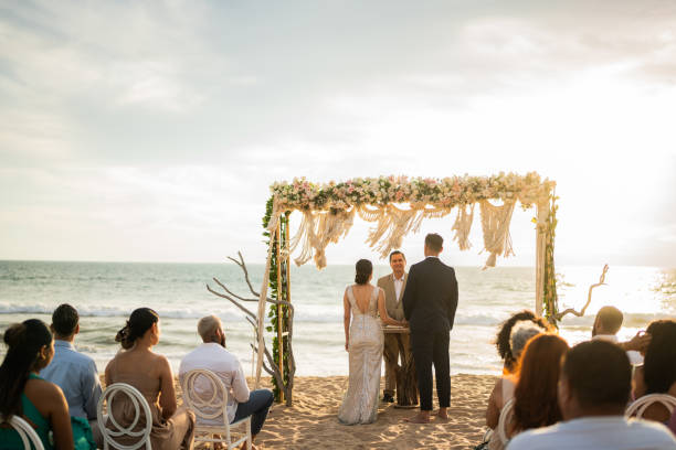 istock Groom and bride in wedding ceremony on the beach 1933365339
