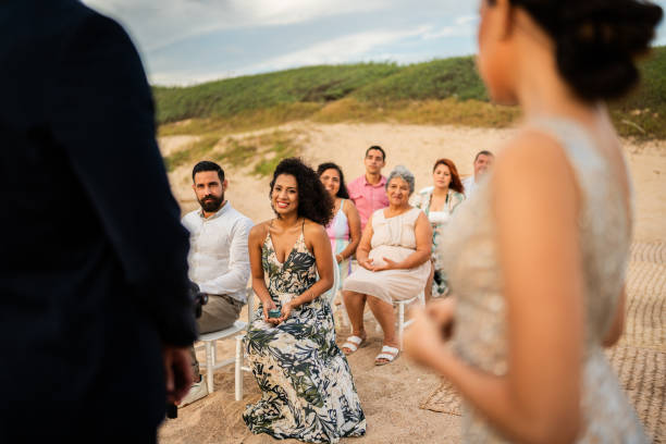 istock Wedding guests watching the ceremony on the beach 1933365345